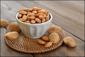 A-small-bowl-filled-with-fresh-Almonds.-Perfect-and-healthy-snack