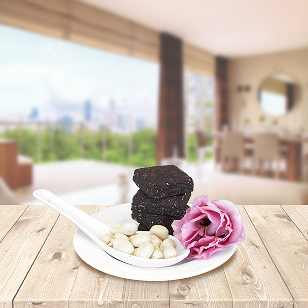 Wooden deck on a green leaves background